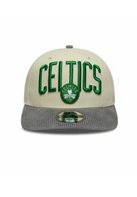 Beige snapback cap with a gray corduroy brim. Features green embroidered "CELTICS" text and a shamrock logo on the front.