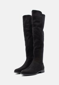 Black suede over-the-knee boots with a tapered toe and low heel. Features a side zipper for easy wear and a soft texture.