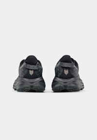 Black athletic shoes with patterned mesh upper, cushioned sole, and reinforced heel tab; features logo at the back and textured outsole.