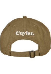 Olive green cap with a curved brim, adjustable back strap, and embroidered "Cayler." text in white on the rear. Cotton material with textured finish.