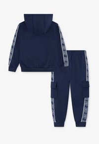 Nike Sportswear JOGGER TAPING UNISEX SET - Sweat à capuche - midnight navy