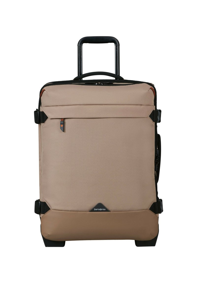 Beige Rollkoffer mit ausziehbarem Griff, Reißverschlussverschluss, Fronttasche und schwarzen Akzenten. Glatte Textur und robuste Rollen.
