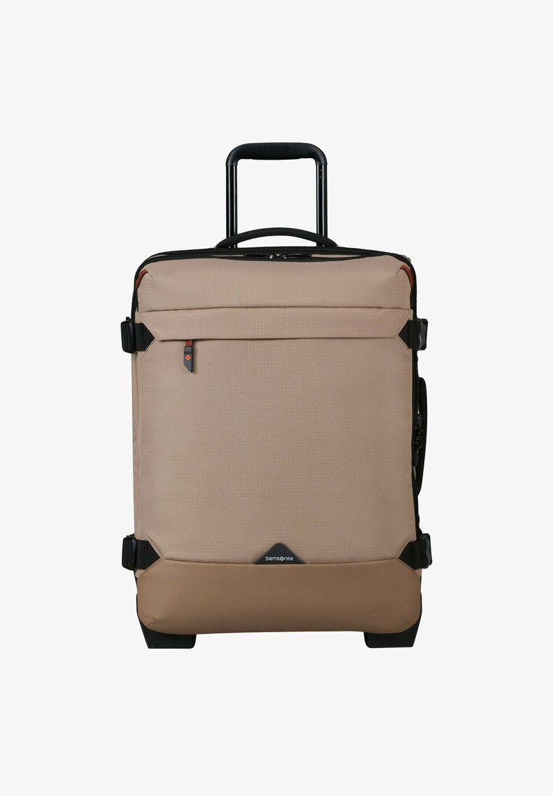 Beige Rollkoffer mit ausziehbarem Griff, Reißverschlussverschluss, Fronttasche und schwarzen Akzenten. Glatte Textur und robuste Rollen.