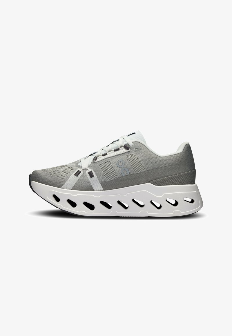 Lightweight gray athletic shoe with a textured upper, white accents, elongated sole, and ventilation cutouts for breathability.