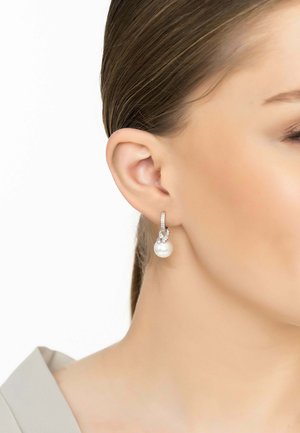Pearl drop earrings with a silver hoop, featuring a row of small clear crystals on the hoop and a smooth, lustrous pearl pendant.