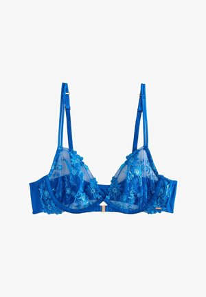 Blauwe kanten bralette met bloemenborduring, doorzichtige mesh cups, verstelbare banden en een goudkleurig hardware accent in het midden.