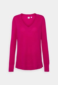 Fuksjowy sweter z długim rękawem, z dekoltem w kształcie V, o teksturowanym splocie i ściągaczu na dole. Posiada boczne rozcięcia dla dodatkowego efektu.