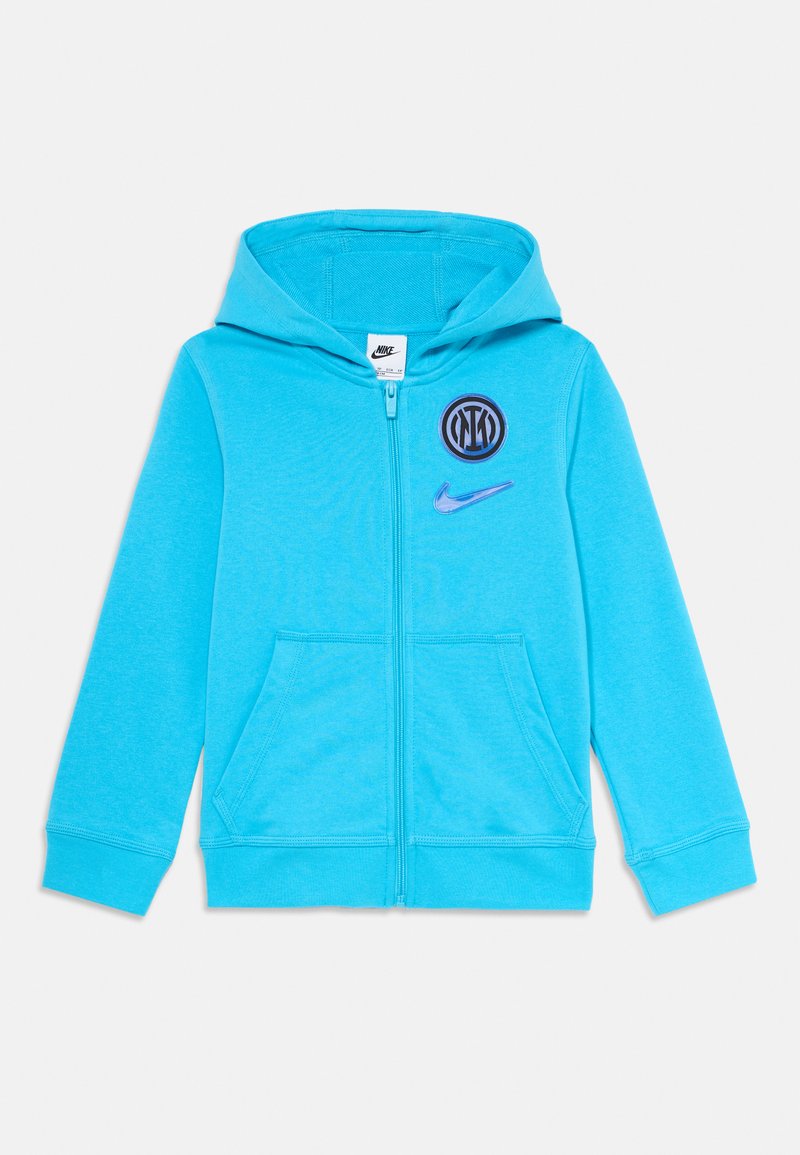 Hoodie turquoise zippé en tissu doux, doté d'une poche avant, d'une capuche et d'un logo Nike avec un détail graphique circulaire.