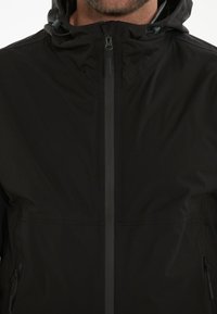 Endurance KOMINT - Runningjack -  black