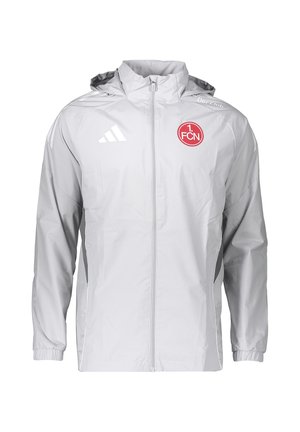 Giacca sportiva grigio chiaro con zip integrale e cappuccio, logo Adidas sul petto sinistro e stemma rosso della squadra di calcio 1. FCN sul petto destro.
