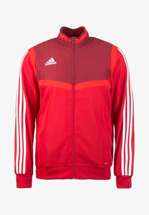 Red Adidas track jacket with a maroon upper section, white diagonal stripes on sleeves, stand-up collar, and full-length zipper.