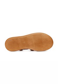 Rubber shoe sole in brown. Features textured grips and ridges for traction, with a smooth perimeter. Slightly curved shape at toe.