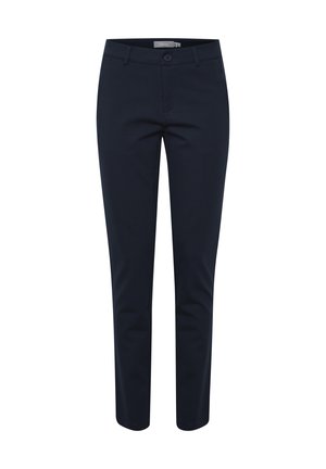 Tumsnējs zils cieši piegulošs bikses ar pogu un rāvējslēdzēja aizdari, jostas cilpām un sānu kabatām, attēlotas baltā fona.