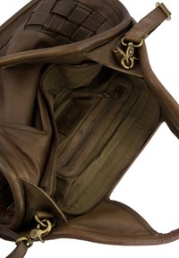 Brown leather bag with woven accent. Interior features dark fabric lining, zippered pocket, and additional compartments. Metal hardware visible.