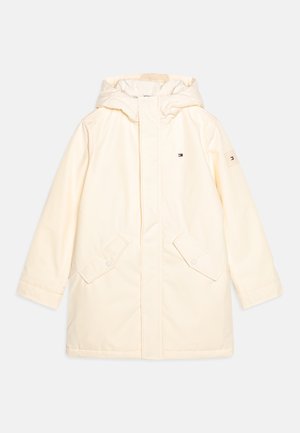 Crème-kleurige parka met een capuchon, voorzien van een ritssluiting aan de voorkant, sluitingen met drukknoop en twee grote zijzakken. Logo-opdruk op de linker mouw.