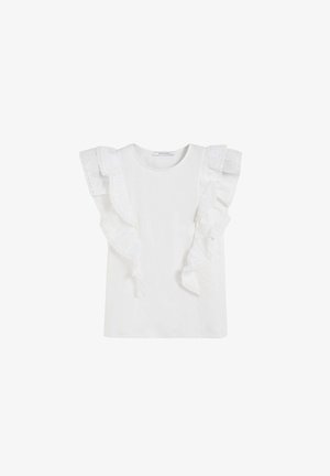 Blouse blanche sans manches avec bordure en dentelle froncée le long des épaules et des côtés, avec un col rond.