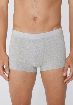Boxer briefs grigi in un tessuto morbido e elasticizzato. Presentano una tasca frontale di supporto e una cintura elastica liscia. Design minimalista.