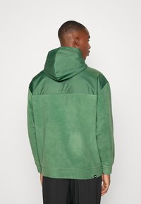 Puma HALF ZIP - Jersey con capucha - deep forest