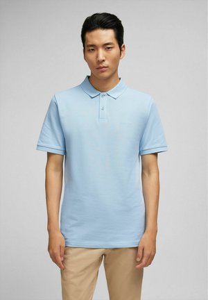 Lichtblauwe poloshirt van katoen met een textuurafwerking, voorzien van een klassieke kraag, twee knopen en subtiele logo-borduring.