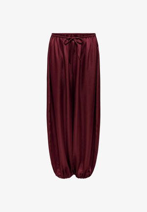 Pantalones sueltos de satén color granate con cintura elástica y cordón, puños elásticos fruncidos en los tobillos.