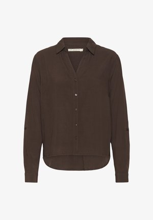 Ruda ilga rankovėliams mygtukais užsegama marškiniai su apykakle, tiesiu apačiu, subtiliu blizgesiu ir rankovėmis, kurias galima užsukti. Lygi audinio tekstūra.