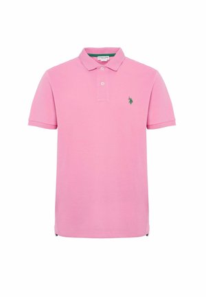 Polo shirt rosa con colletto classico, maniche corte e logo verde sul lato sinistro del petto. Realizzato in cotone, presenta delle aperture laterali.