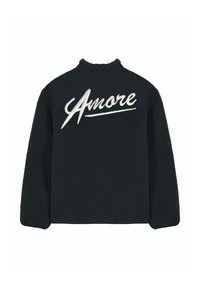 Veste en polaire noire avec col montant et "Amore" brodé en écriture cursive blanche sur le haut du dos.