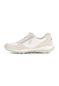 Light beige sneaker featuring a combination of suede and mesh materials, lace-up design, side zipper, and textured sole.