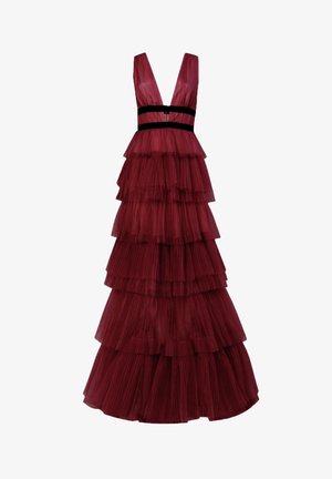 Deep red tiered tulle gown with a deep V-neckline and black waistband detail.