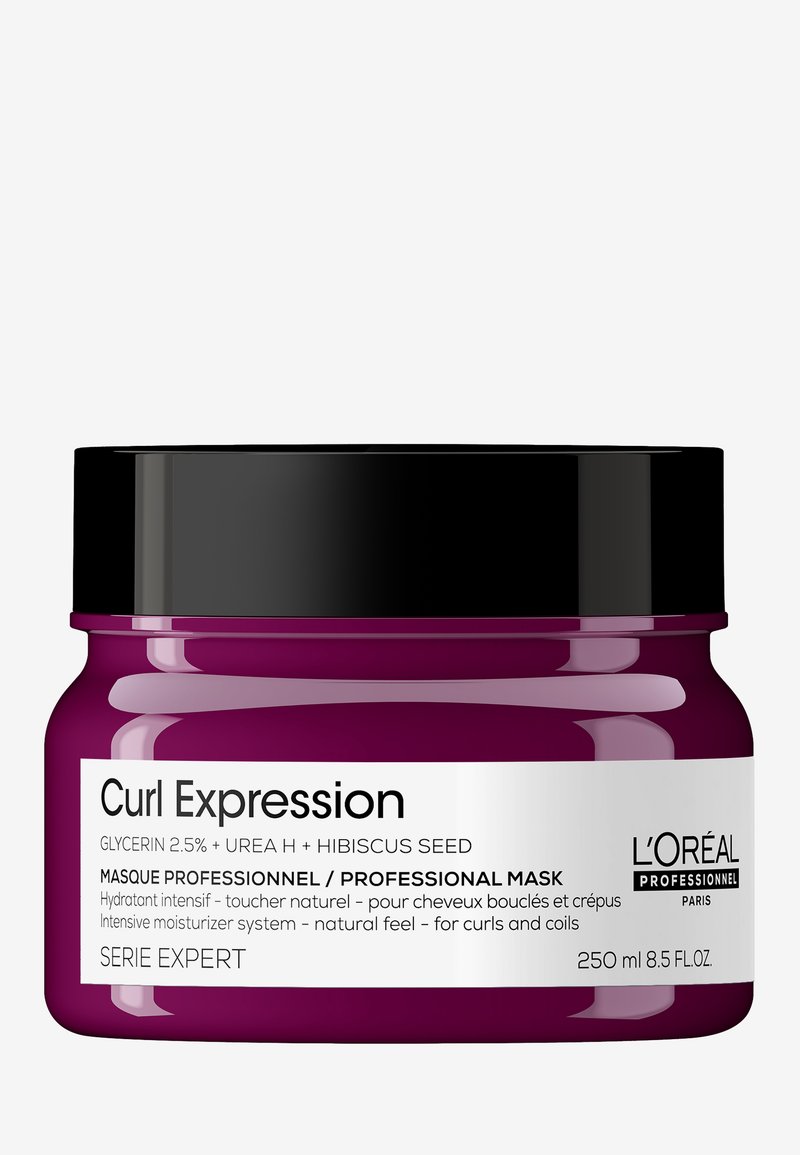 Profesjonalna maska do włosów kręconych Curl Expression, 250 ml, w fioletowym słoiku z czarną pokrywką. Posiada białe napisy szczegółowo opisujące składniki i sposób użycia.