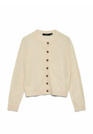 Lys beige cardigan lavet af blødt strikket materiale. Har en rund halslinje, lange ærmer og otte brune knapper foran.