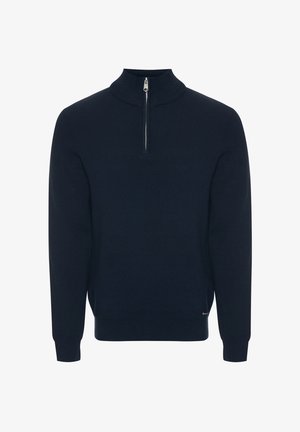 Marineblauwe gebreide trui met een hoge kraag, voorzien van een halve rits en geribde boorden. Zachte textuur met een minimalistisch ontwerp.