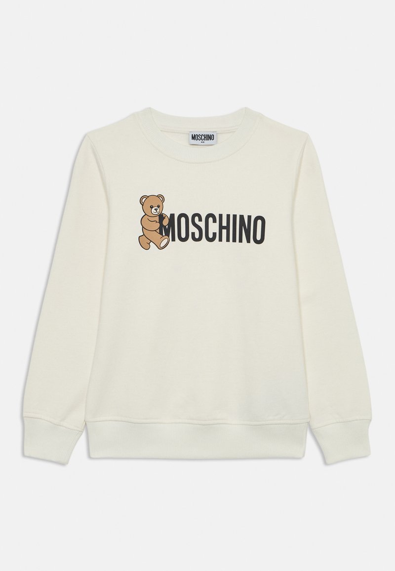 Lys kremfarget sweatshirt laget av mykt stoff, med en tegneserie-bjørn og "MOSCHINO" trykt med fete svarte bokstaver. Lange ermer med ribbestrikkede mansjetter.