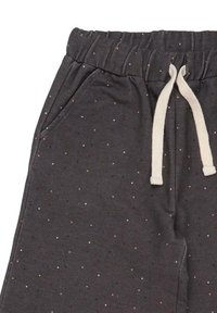 Gray sweatpants feature a textured fabric with a soft feel, elastic waist, drawstring closure, and multicolored speckled pattern.