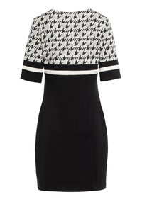 Sukienka z krótkim rękawem w czarno-białą kratkę houndstooth na górze, z jednolitą czarną dolną częścią oraz białymi akcentującymi paskami.