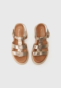 Bronzefarbene metallische Sandalen mit mehreren Riemen und einem Schnallenverschluss. Mit einer braunen Lederinnensohle und einer hellen Gummisohle. Größe 37.