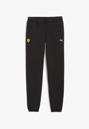 Pantalon de survêtement noir avec taille et poignets élastiques, avec un logo Ferrari jaune sur la cuisse gauche et un logo Puma blanc sur la cuisse droite.