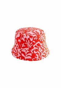 Red and white patterned bucket hat with floral motifs, made of fabric, featuring a wide brim and a rounded crown.