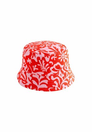 Red and white patterned bucket hat with floral motifs, made of fabric, featuring a wide brim and a rounded crown.