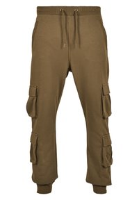 Cargo joggebukser i olivengrønn, med snøring i livet, sidelommer og store cargo-lommer på hver lår med ribbede mansjetter.