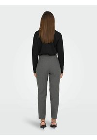 High-waisted gray trousers with a textured fabric, tapered leg design, and a solid pattern, paired with a black long-sleeve top.