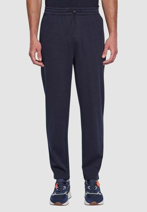 Pantaloni jogger blu navy con vita elastica e coulisse, dotati di tasche laterali e design con gamba affusolata. Tessuto morbido ed elastico.