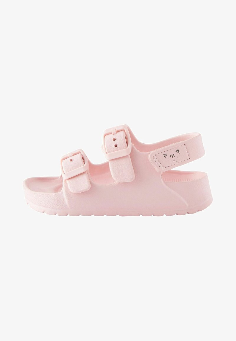 Sandale en plastique rose avec deux boucles réglables et une sangle arrière rembourrée, dotée d'une semelle texturée et d'un subtil design de visage de chat.