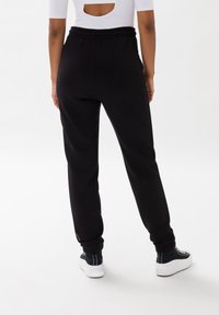 Les Lunes FRAYAA - Træningsbukser - schwarz