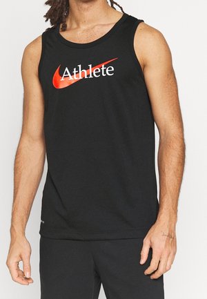 Man wearing sleeveless black athletic top with red Nike swoosh and word "Athlete" in white across chest.