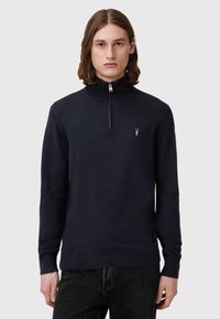 Marineblauer Zip-Hals-Pullover mit langen Ärmeln, weichem Material und einem kleinen Logo-Akzent auf der Brust. Glattes, figurnahes Design.