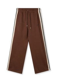 Pantalon de survêtement marron avec une taille élastique et un cordon de serrage, présentant des bandes latérales crème et des accents noirs, fabriqué en coton doux.