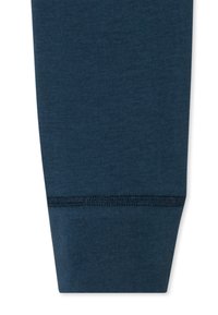 Leggings in cotone blu navy con una texture liscia, forma aderente e polsini elasticizzati con cuciture a contrasto.