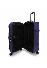 Valigia a rotelle viola con interno nero, doppia zip, tasche in rete e manico retraibile. Ruote lisce per una facile mobilità.