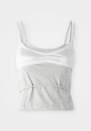 Grijze en witte camisole met verstelbare bandjes, met een satijnen bovenstuk en een gestructureerd grijs katoenen onderstuk, strakker gemaakt bij de taille.